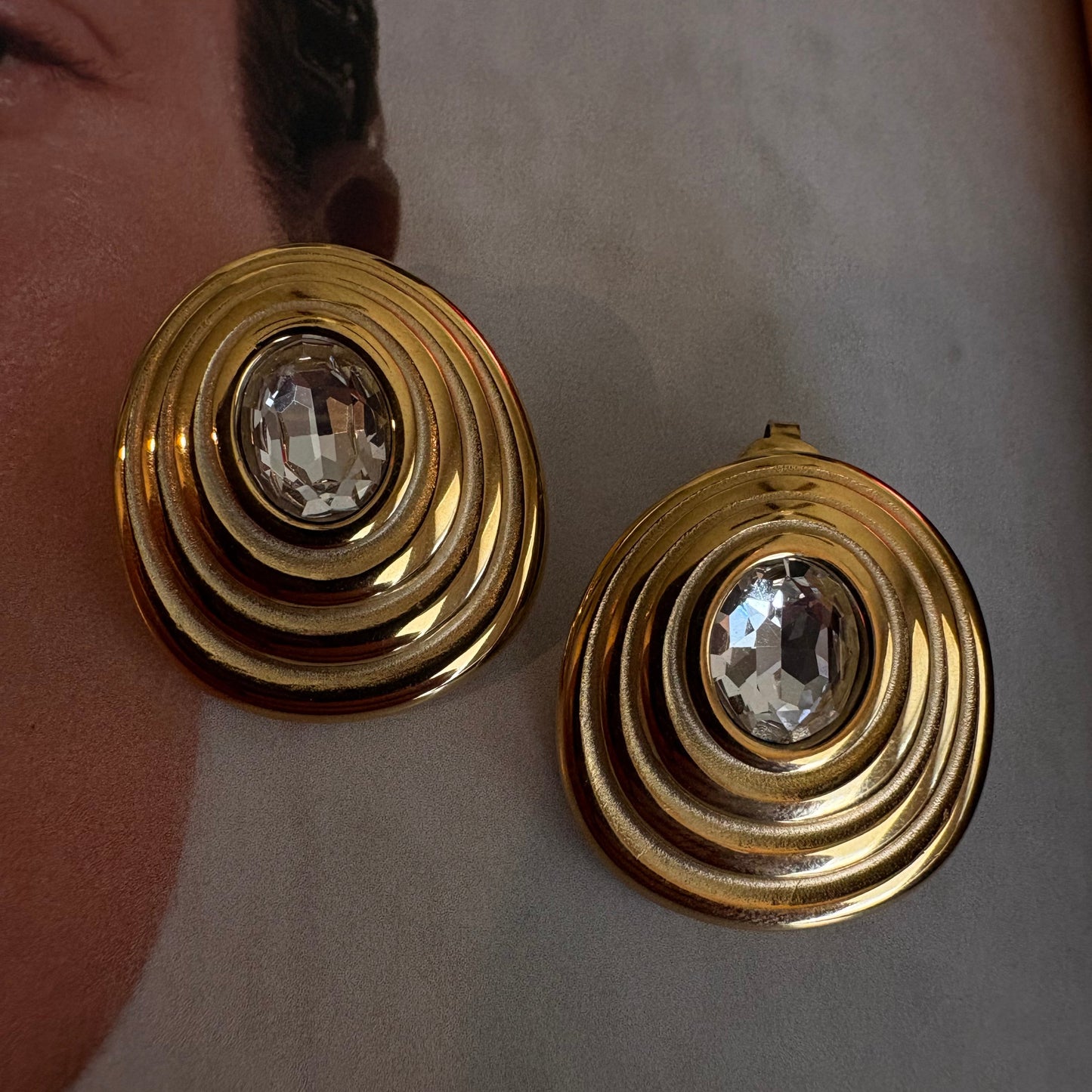 Amelia spiral zircon earrings worn on ear
