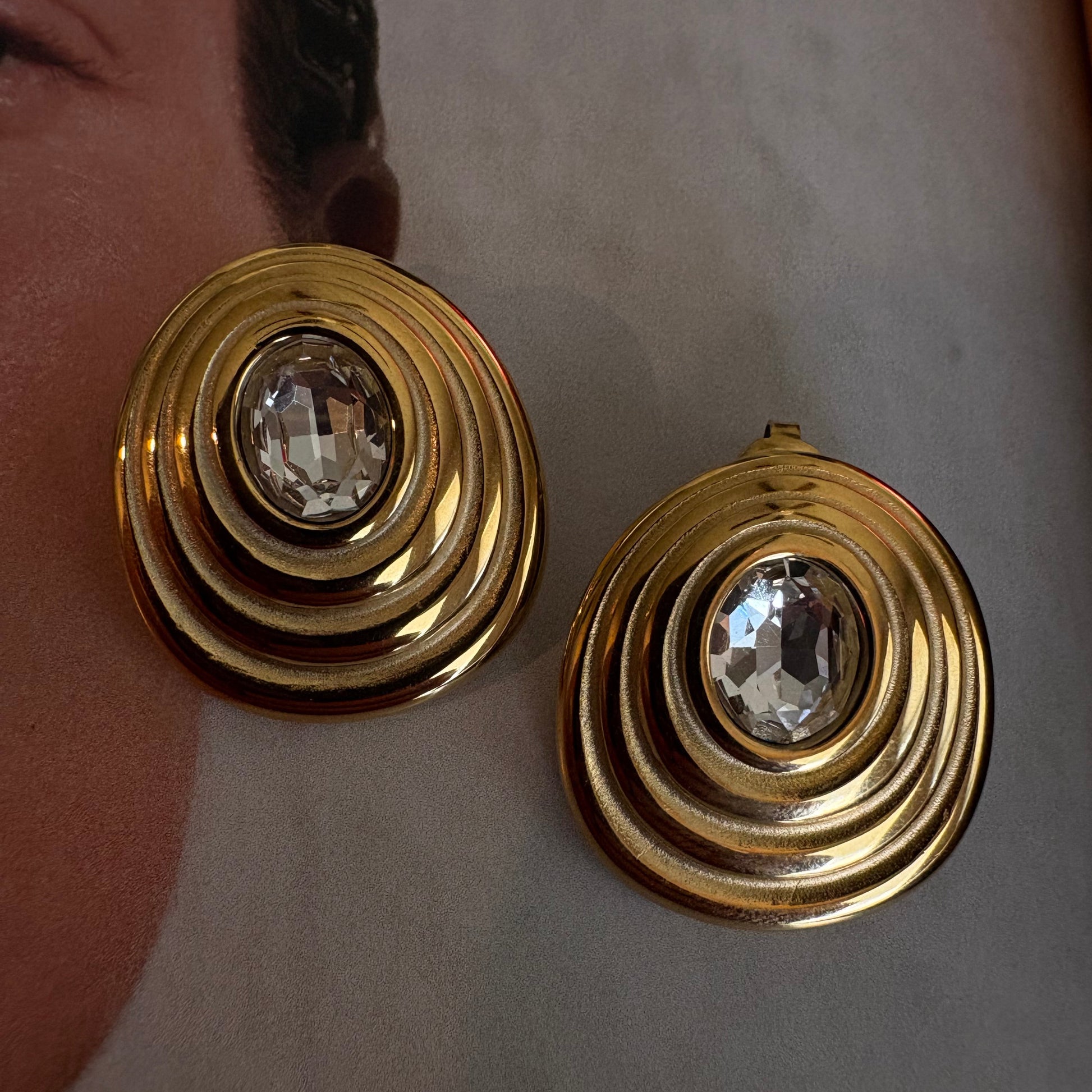 Amelia spiral zircon earrings worn on ear