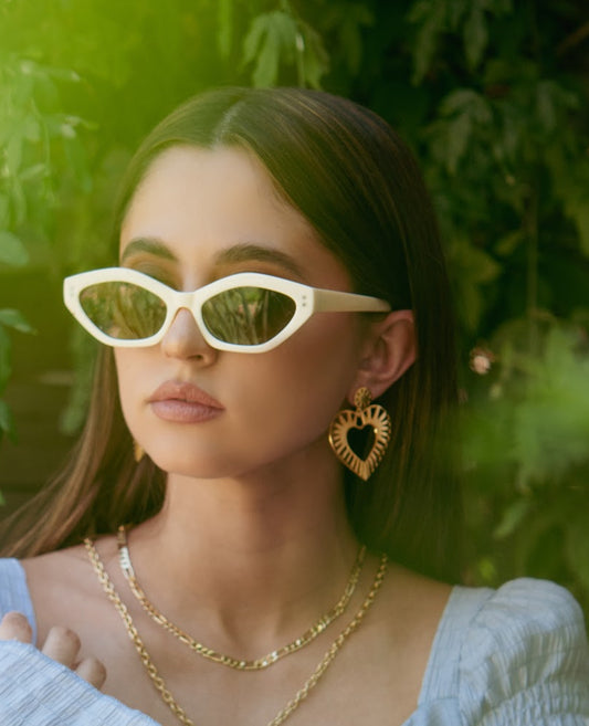 Model wearing bold gold heart earrings

Striped texture gold heart statement earrings

Lightweight heart earrings for bold looks