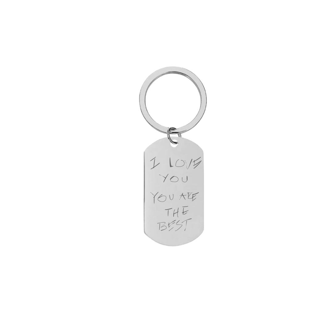 A rectangular silver keychain with engraved text 'I love you you are the best' on a white background.