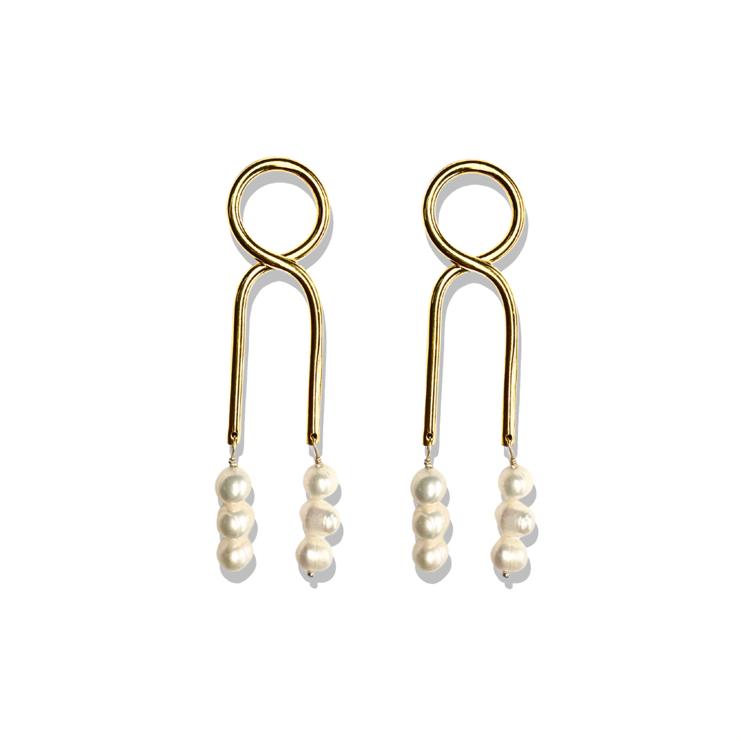 Gold Knot Pearl drop earrings with modern design on neutral background. 