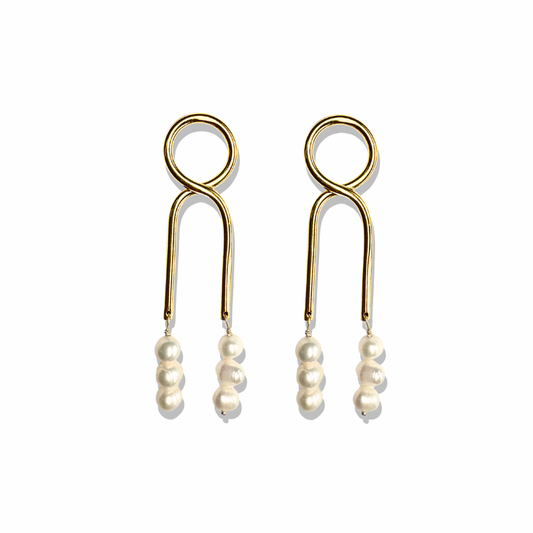Gold Knot Pearl drop earrings with modern design on neutral background. 